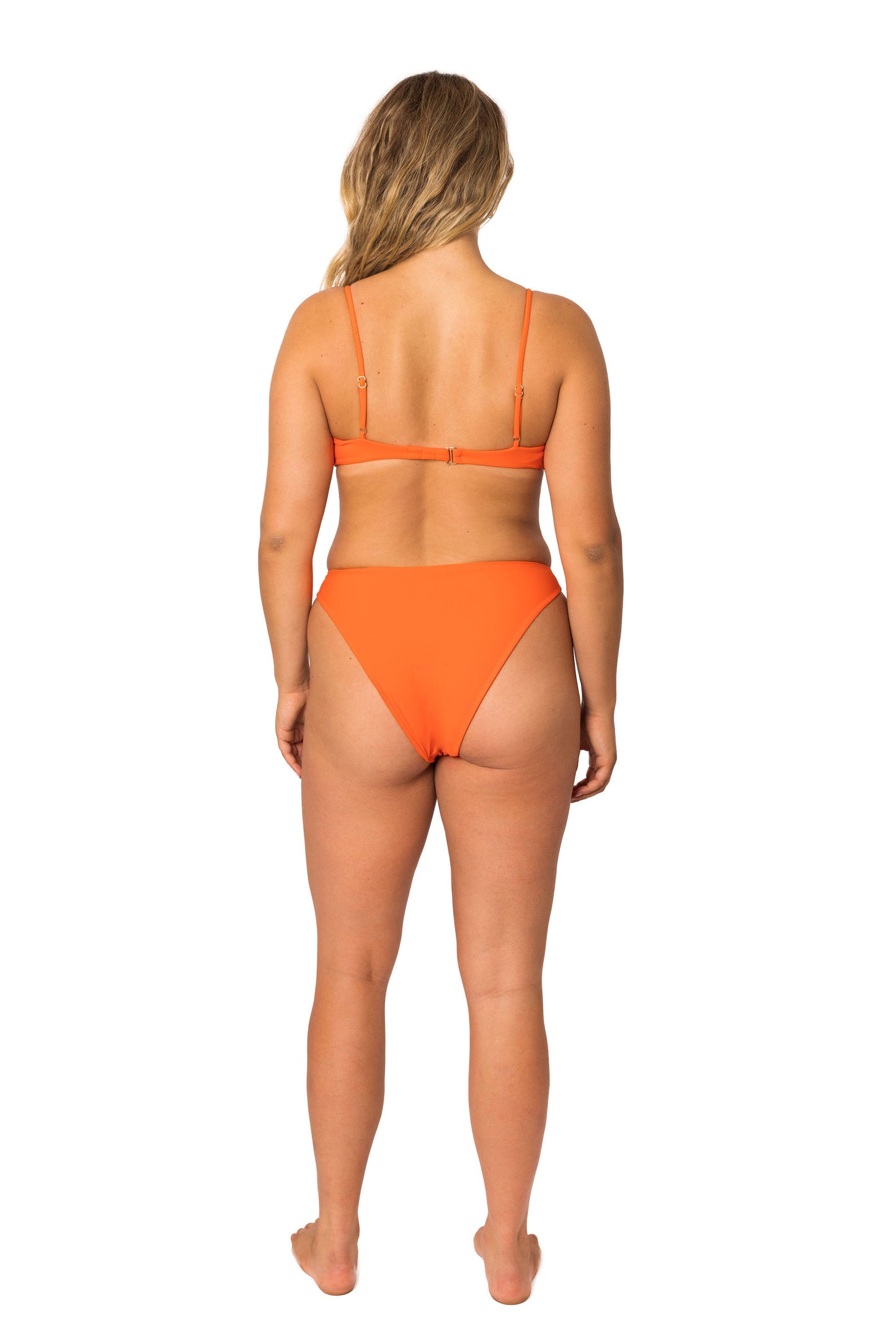 Orange high-cut seamless bathing suit bikini bottom with the perfect amount of cheeky coverage in orange. Equally flattering as comfortable.